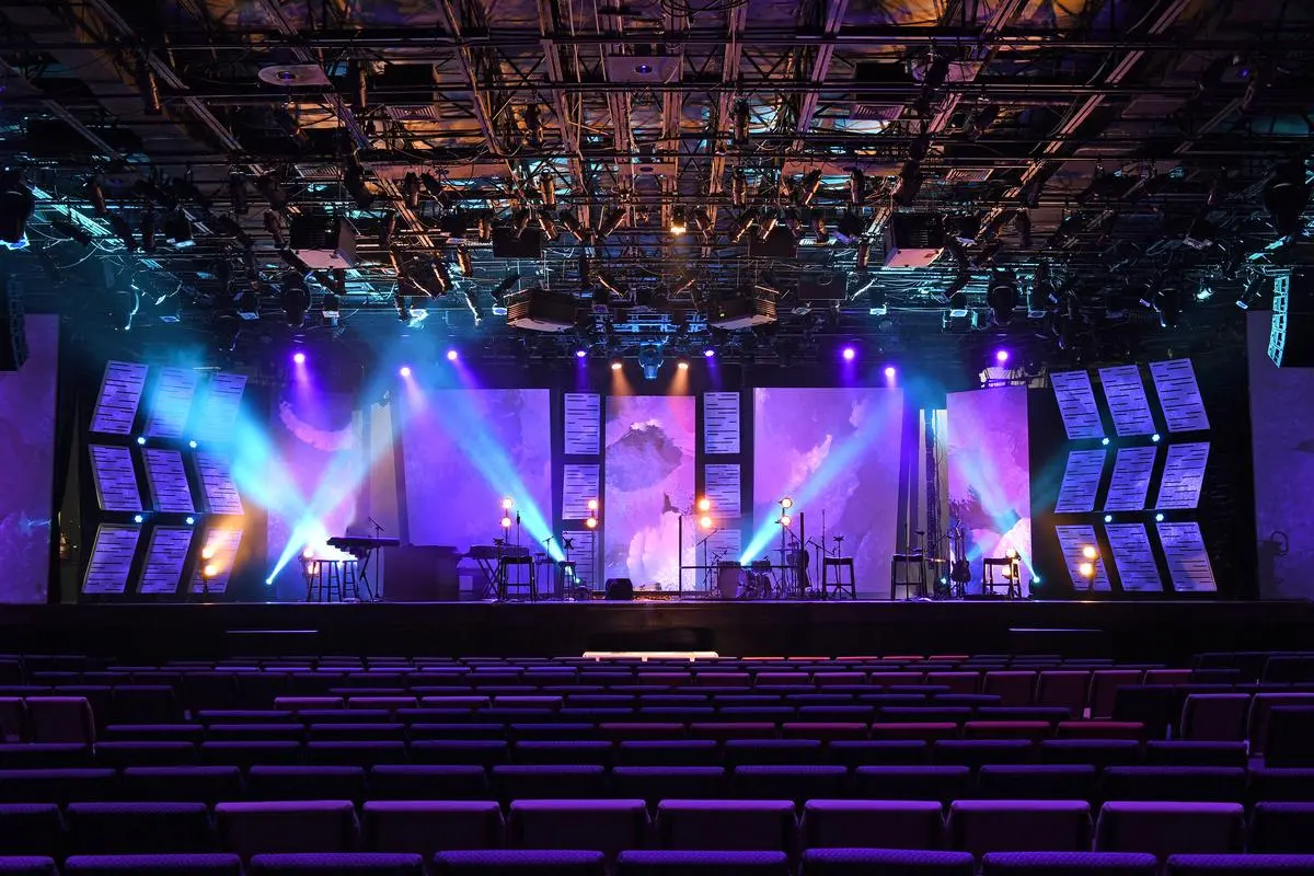 Stage lighting design layout with printed technical plans and spotlights